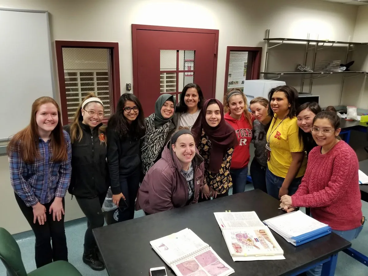 A group of students standing together in a university laboratory